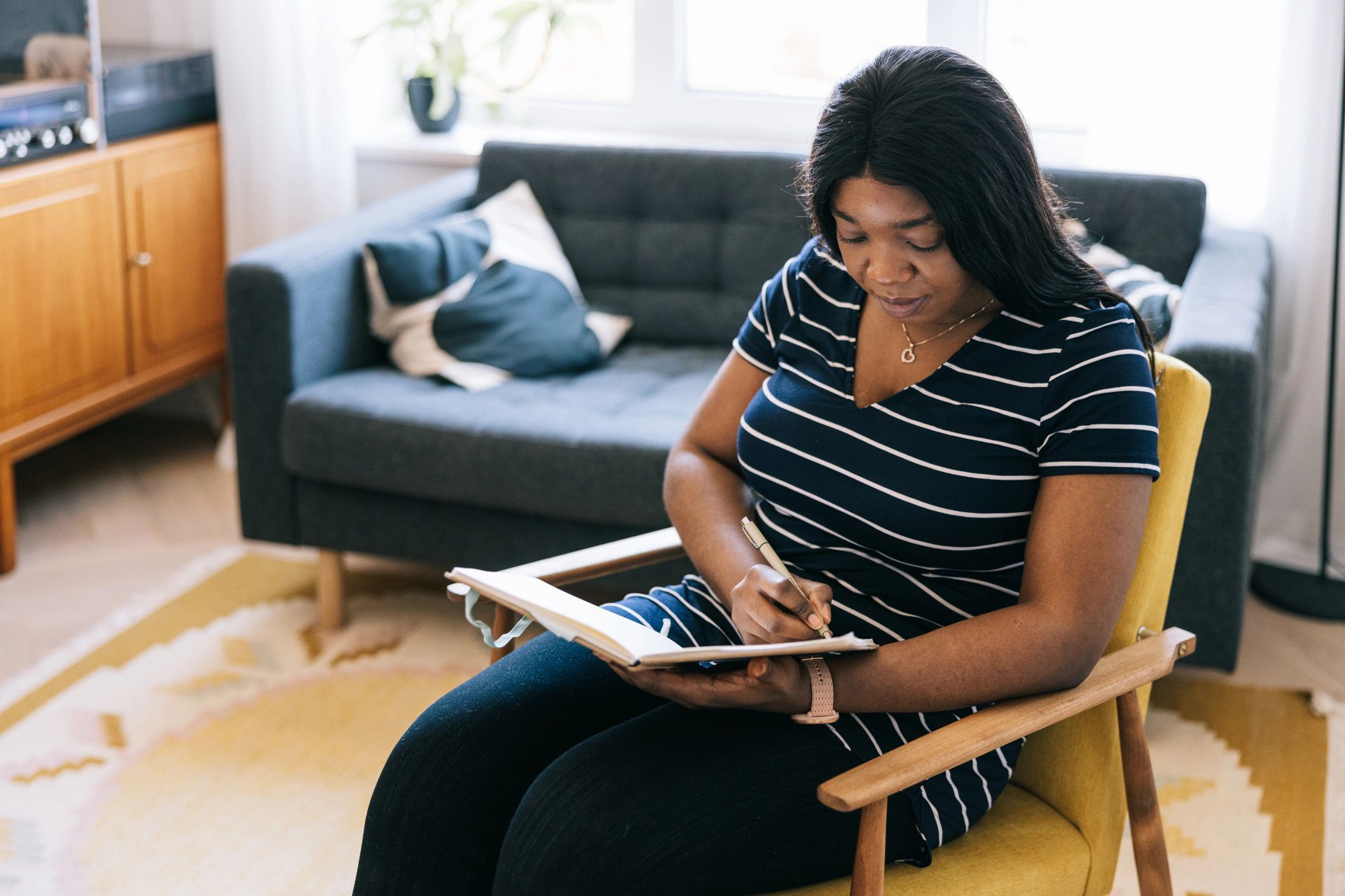 Woman reading and studying at home